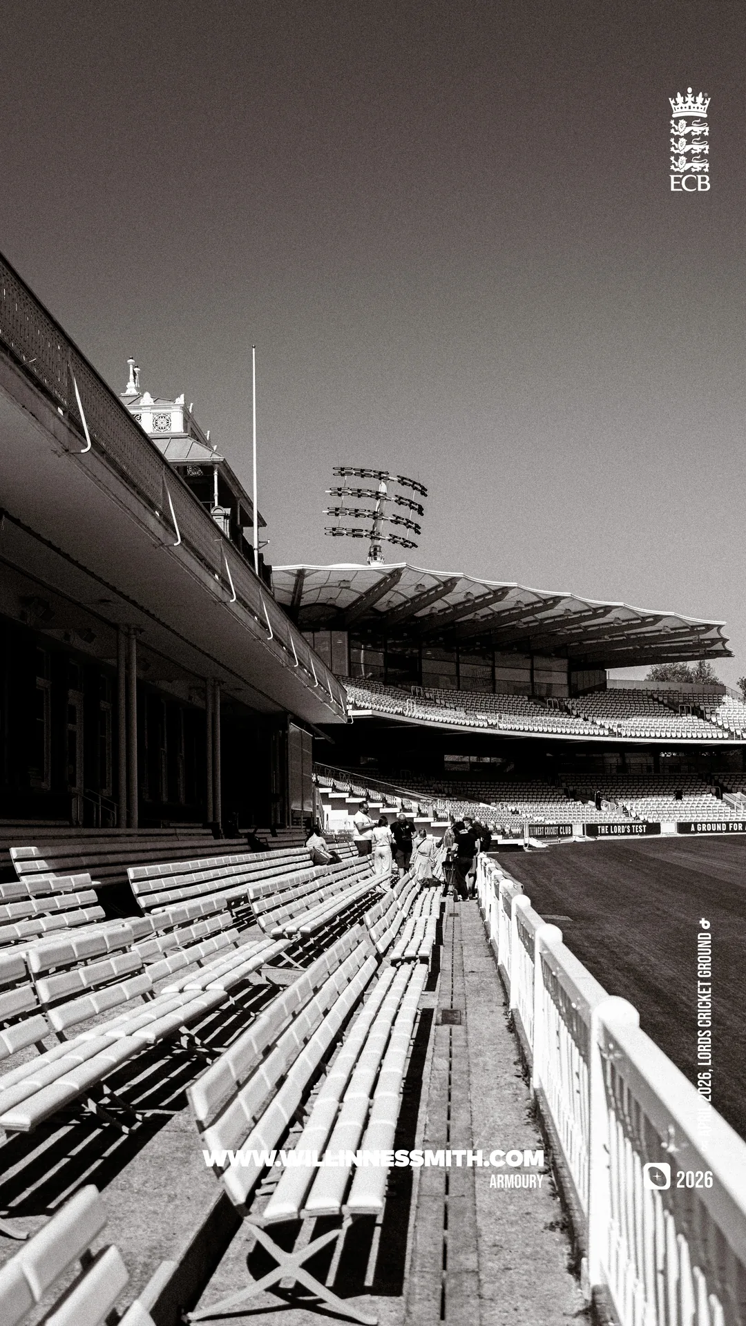 Black-and-white grandstand and empty seats with a floodlight, Lord's