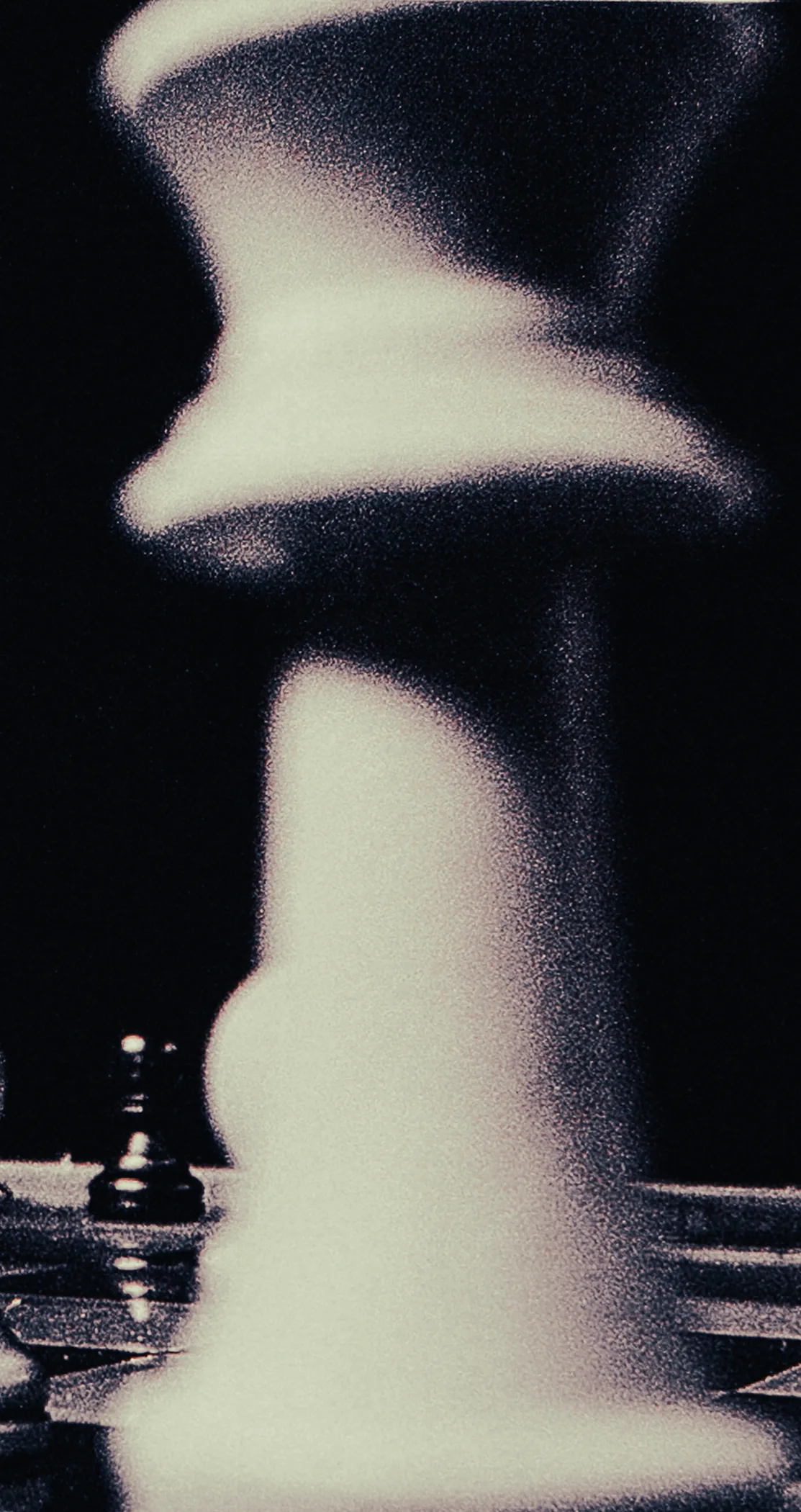A monochrome bloom of light flaring across a dark frame, Lights Out